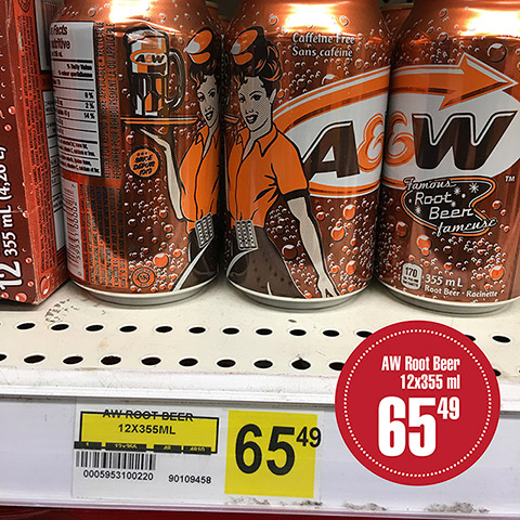 A&W brand root beer cans rest on a display. A label specifies the selling price of $65.49 for 12 cans of 355 millilitres each.

